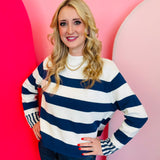 Zenana Navy striped cotton sweater with relaxed boxy fit, crew neckline, and contrast striped cuffs.