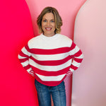 Zenana Hot pink striped cotton sweater with boxy fit, crew neckline, and contrast striped cuffs.