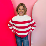 Zenana Hot pink striped cotton sweater with boxy fit, crew neckline, and contrast striped cuffs.