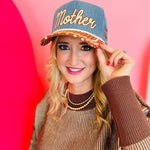 Denim “Mother Knows Best” trucker hat with rust brim, polka dots, and embroidered back icons.