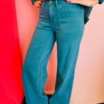 Teal Judy Blue wide-leg jeans with high rise, clean hem, and classic pockets.