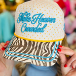 Poppy and Pine Cream polka dot faith hat with blue “Make Heaven Crowded” embroidery and zebra print bill.