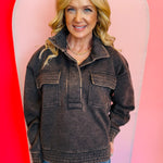 Ash black acid wash half-snap fleece sweatshirt with relaxed fit and snap button front.