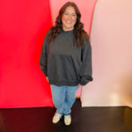 Acid washed oversized black sweatshirt with neck overlay.