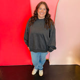 Acid washed oversized black sweatshirt with neck overlay.