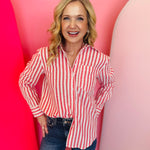 Red and white striped oversized cotton button-down shirt with long sleeves for bold everyday style.