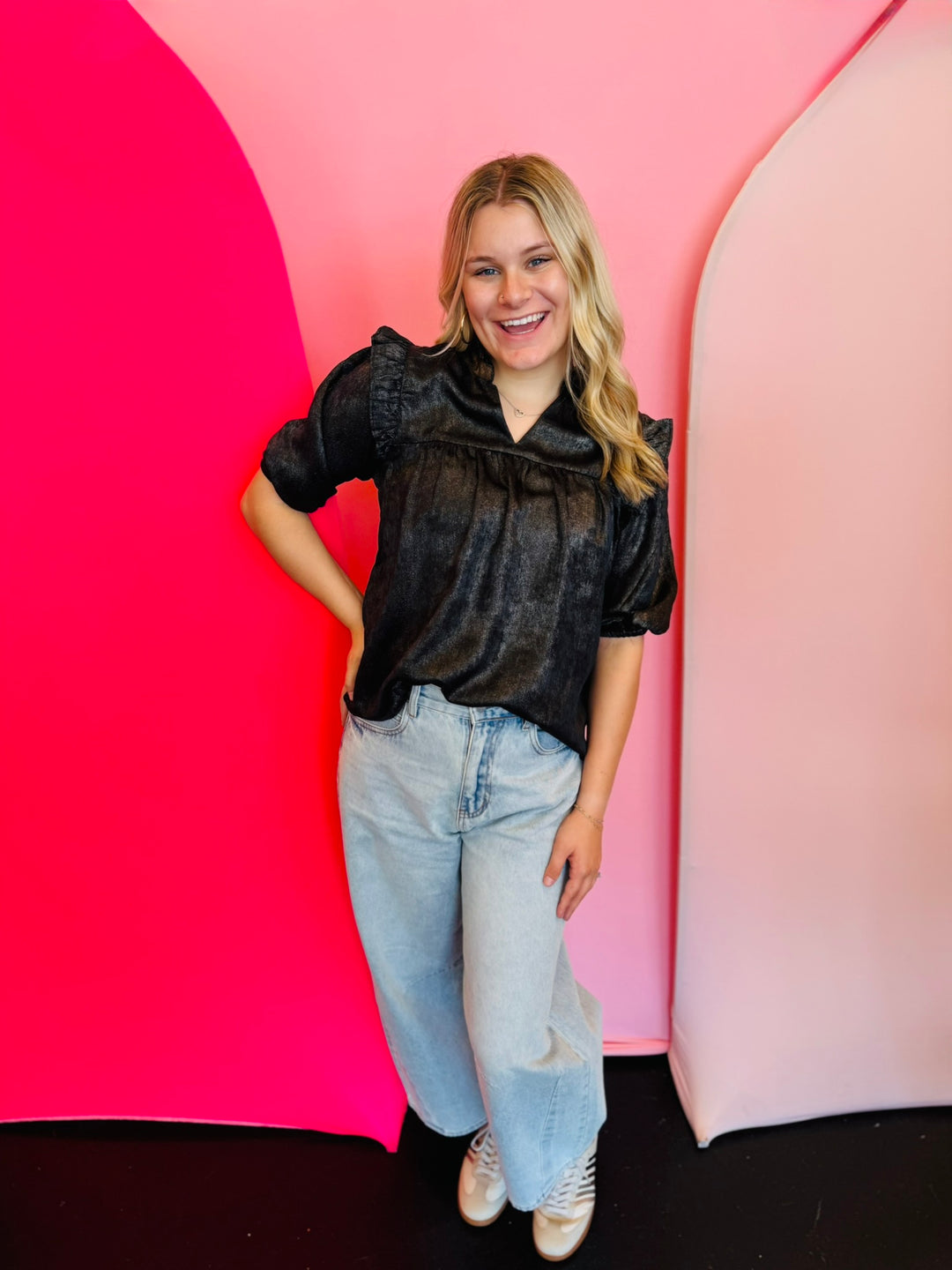 Black metallic ruffle blouse with V-neck and 3/4 sleeves.