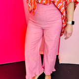 Pink high-rise straight-leg pants with feminine ruffled hem and sleek back zipper closure.