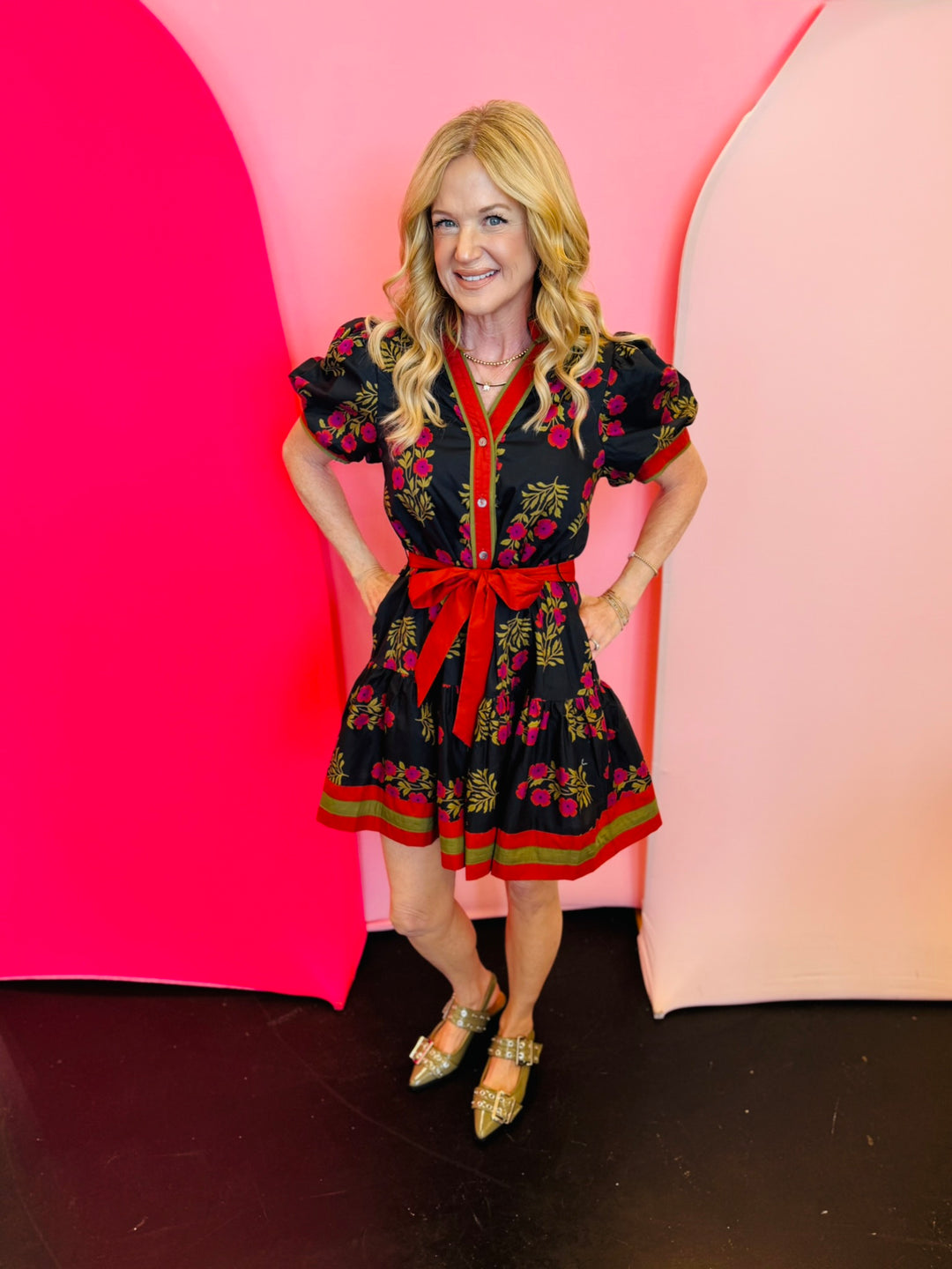 Black & Red Floral Dress with short puff sleeves, ruffle hem, removable belt, and side pockets.