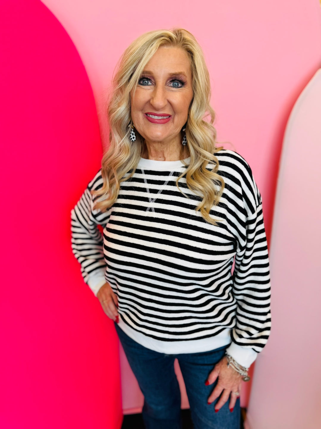 Black Striped Pullover with soft fabric, relaxed fit, and classic black-and-white stripes for effortless style.