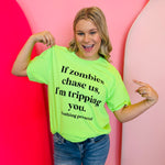 Bright green Zombie Tripping Tee with cheeky “If zombies chase us, I’m tripping you” graphic.