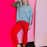 Red high-rise kick flare cropped jeans with stretchy fabric and bold, vibrant statement-making style