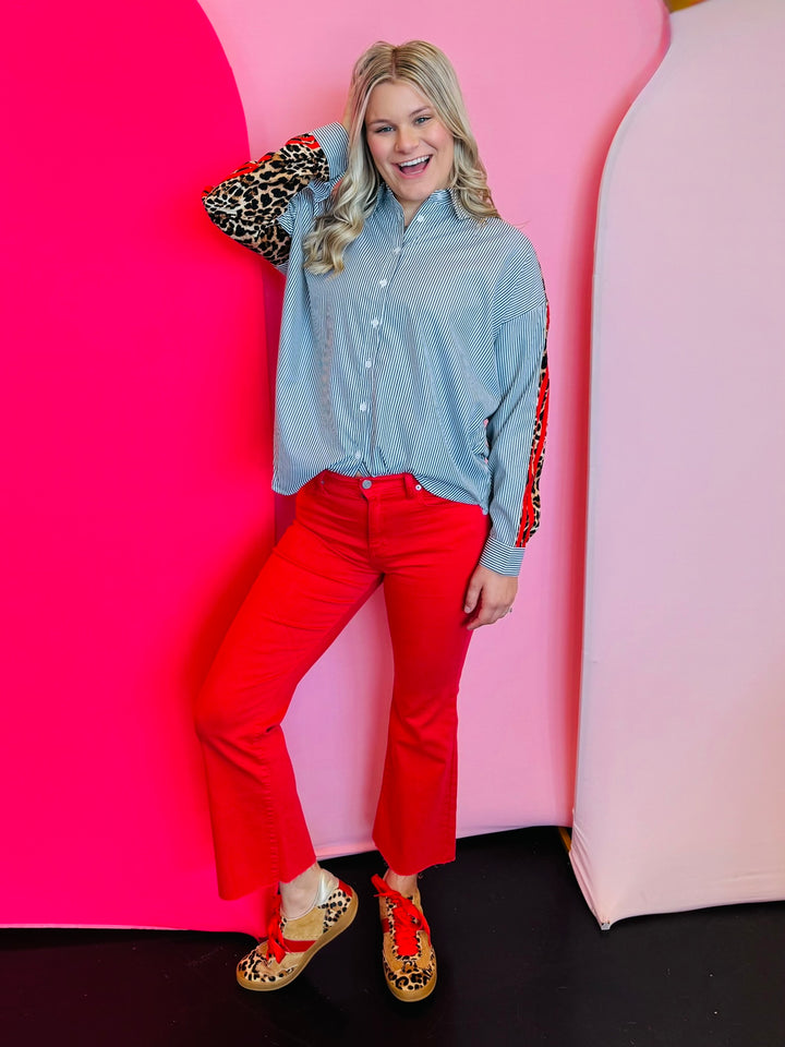 Red high-rise kick flare cropped jeans with stretchy fabric and bold, vibrant statement-making style