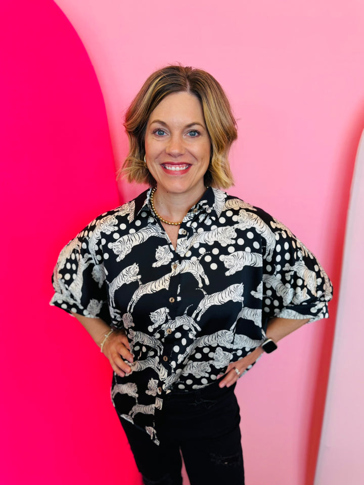 A black and white tiger mix polka dot printed button-down shirt with half sleeves.