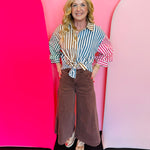 Mahogany high-rise cropped gaucho denim jeans.