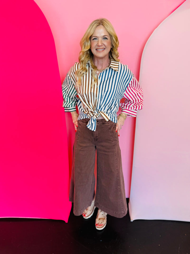 Mahogany high-rise cropped gaucho denim jeans.