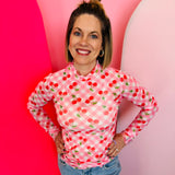 Sheer gingham mesh top with cherry print, mock neckline, and lettuce hems for trendy layered looks.