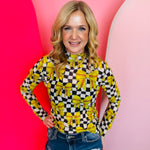 Softball-themed mesh top with bow graphics, lightweight fabric, and sporty feminine style.