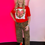 Red tee with leopard heart patch, pink bow, and sparkling bling accents on soft cotton.