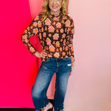 Jess Lea Chocolate mesh top with gingerbread houses, cookies, snowflakes, and festive holiday print details.