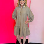 Taupe striped mini dress with collar, balloon sleeves, and ruffle hem.