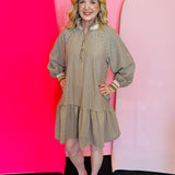 Taupe striped mini dress with collar, balloon sleeves, and ruffle hem.