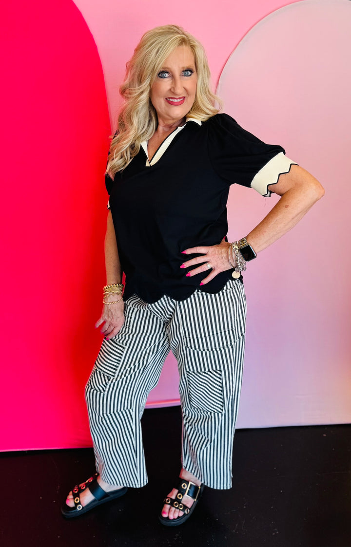 Black twill striped barrel-leg pants with subtle vertical stripes, featuring a natural rope twine belt threaded through eyelet loops; styled for a flattering, modern fit with a breathable 100% cotton fabric.