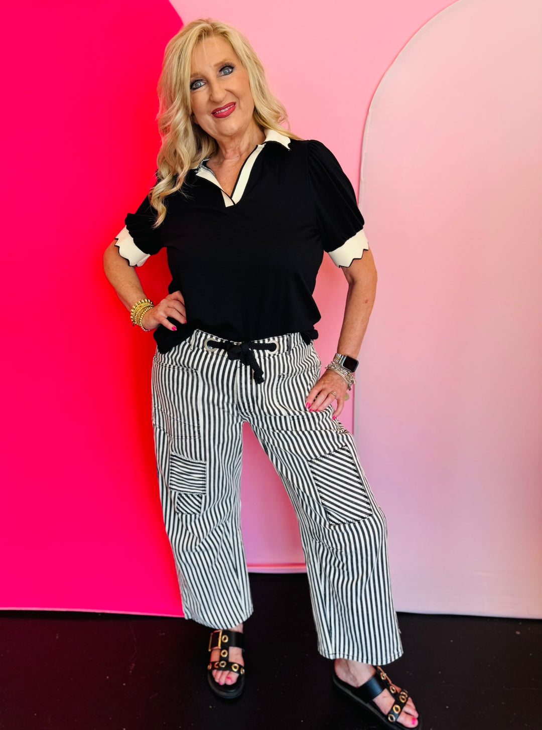 Black twill striped barrel-leg pants with subtle vertical stripes, featuring a natural rope twine belt threaded through eyelet loops; styled for a flattering, modern fit with a breathable 100% cotton fabric.