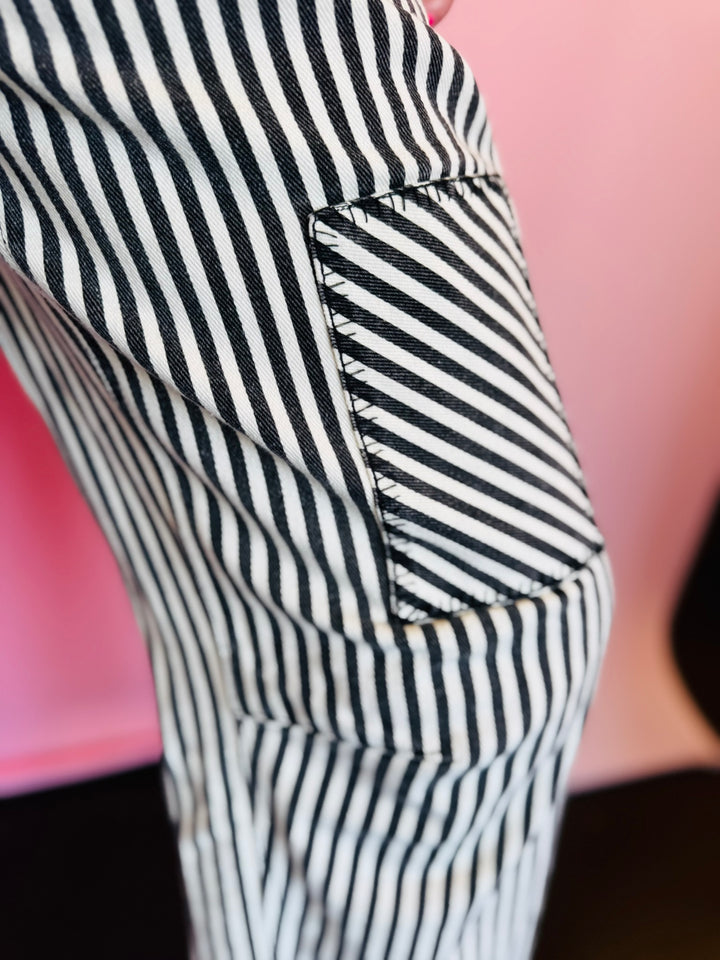 Stitched Pocket on Black twill striped barrel-leg pants with subtle vertical stripes