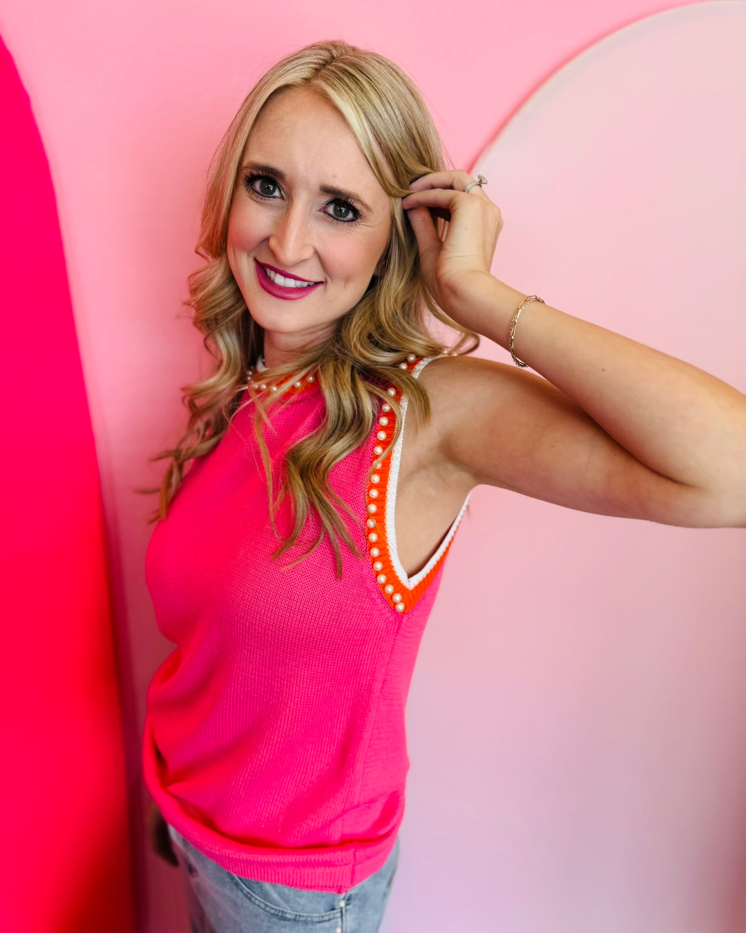 Another angled side view of the vest showcasing the armhole trim and how it lays over the shoulder.