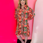 Bright paisley button-down dress with puff sleeves and a relaxed swing fit in bold mixed colors.