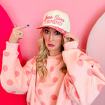 Cream hat with pink polka dot bill and Jesus saves I spend embroidery