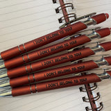 Black stylus pen with bold printed text and soft-touch coating.