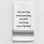 White tea towel with black trim and funny earrings quote.