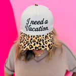 Two-tone vacation hat with embroidered saying and leopard print bill