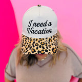 Two-tone vacation hat with embroidered saying and leopard print bill