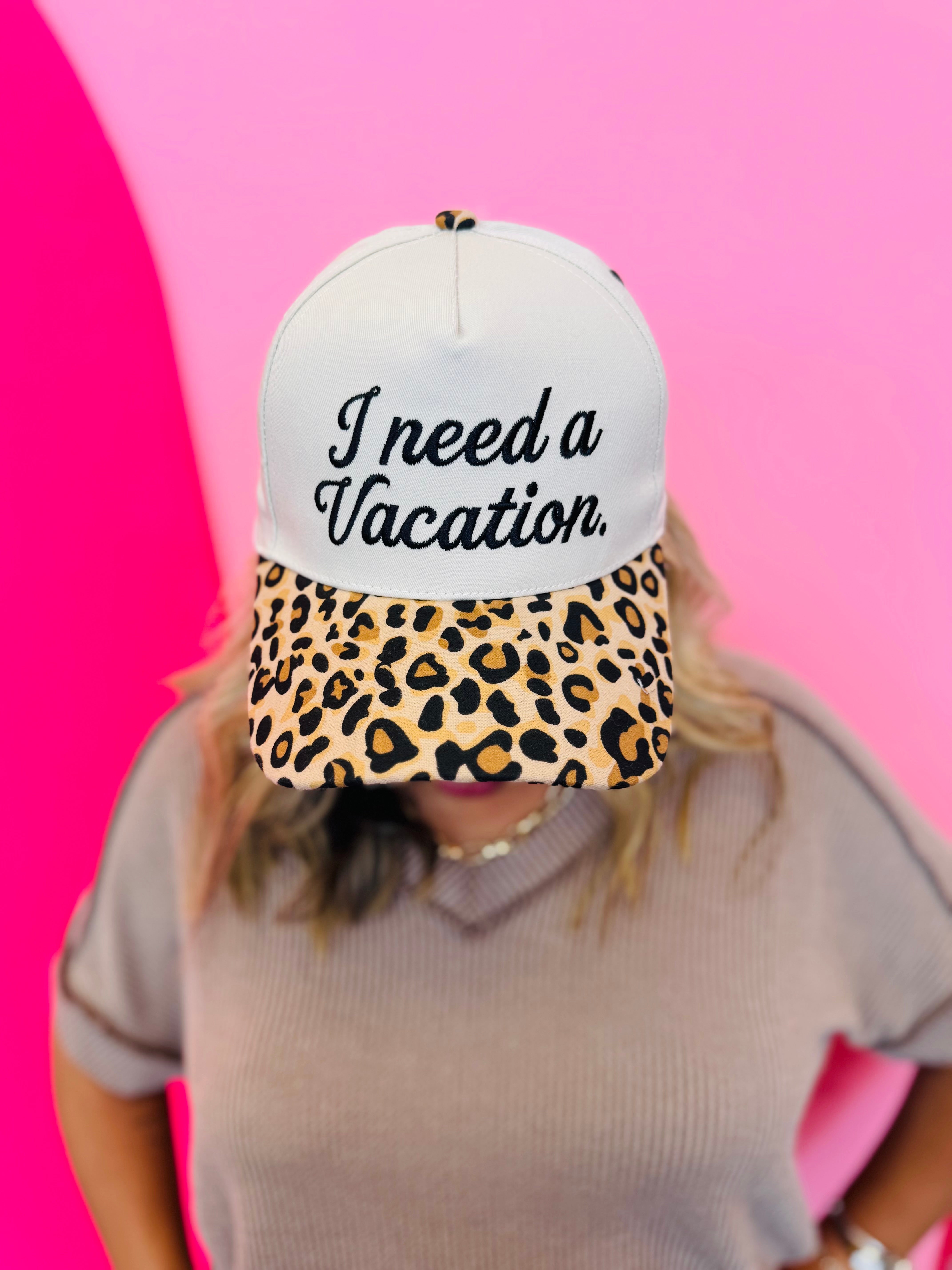 Two-tone vacation hat with embroidered saying and leopard print bill