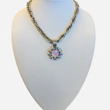 Silver necklace with blush floral pendant and iridescent crystals