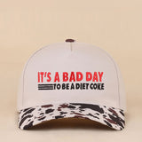 Two-tone snapback hat with It's A Bad Day To Be A Diet Coke embroidered saying.