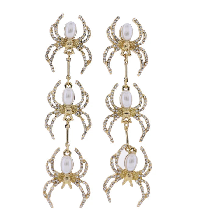 Dangling earrings with descending spiders with pearl bodies and crystal legs