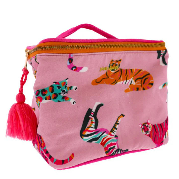 A cube-shaped, zippered pouch made of pink viscose velvet. The pouch features a colorful pattern of various animal prints, including zebra and leopard. A bright pink tassel is attached to the zipper.
