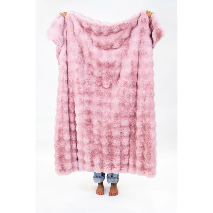Solid pink faux fur throw blanket.