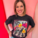 Black leopard print tee featuring Jack the donkey in tropical paradise with printed rhinestone details.