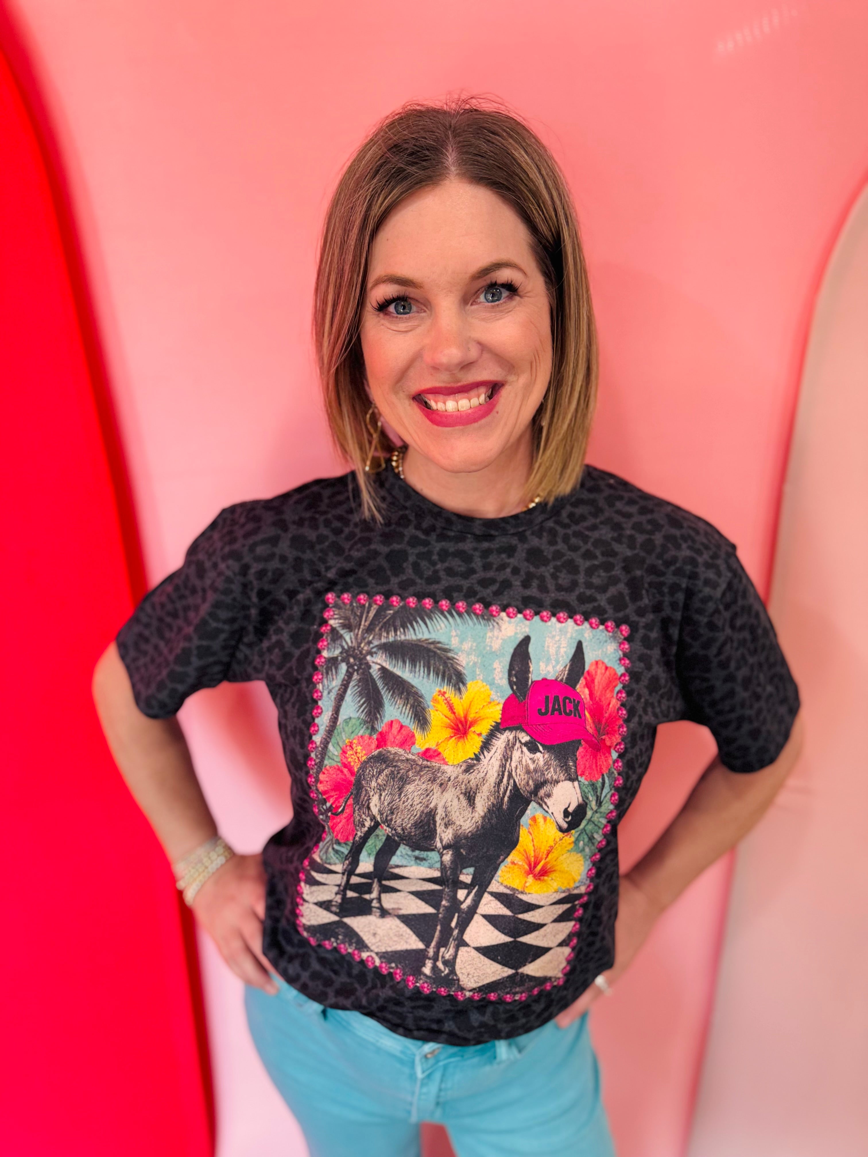 Black leopard print tee featuring Jack the donkey in tropical paradise with printed rhinestone details.
