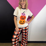 White Halloween tee with stacked pink, red-orange, and orange jack-o’-lanterns.