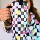 40 oz tumbler with checkered conversation hearts, flip-straw lid, handle, and car cup holder base.