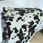 Cowhide Couture Blanket with black and white cow print, soft cozy throw for home décor