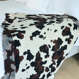 Cowhide Couture Blanket with black and white cow print, soft cozy throw for home décor