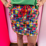 Colorful houndstooth skort with built-in shorts, drawstring waist, and side pockets.