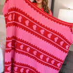 Pink blanket with red stripes and heart accents, soft and cozy in a 50" x 57" size.